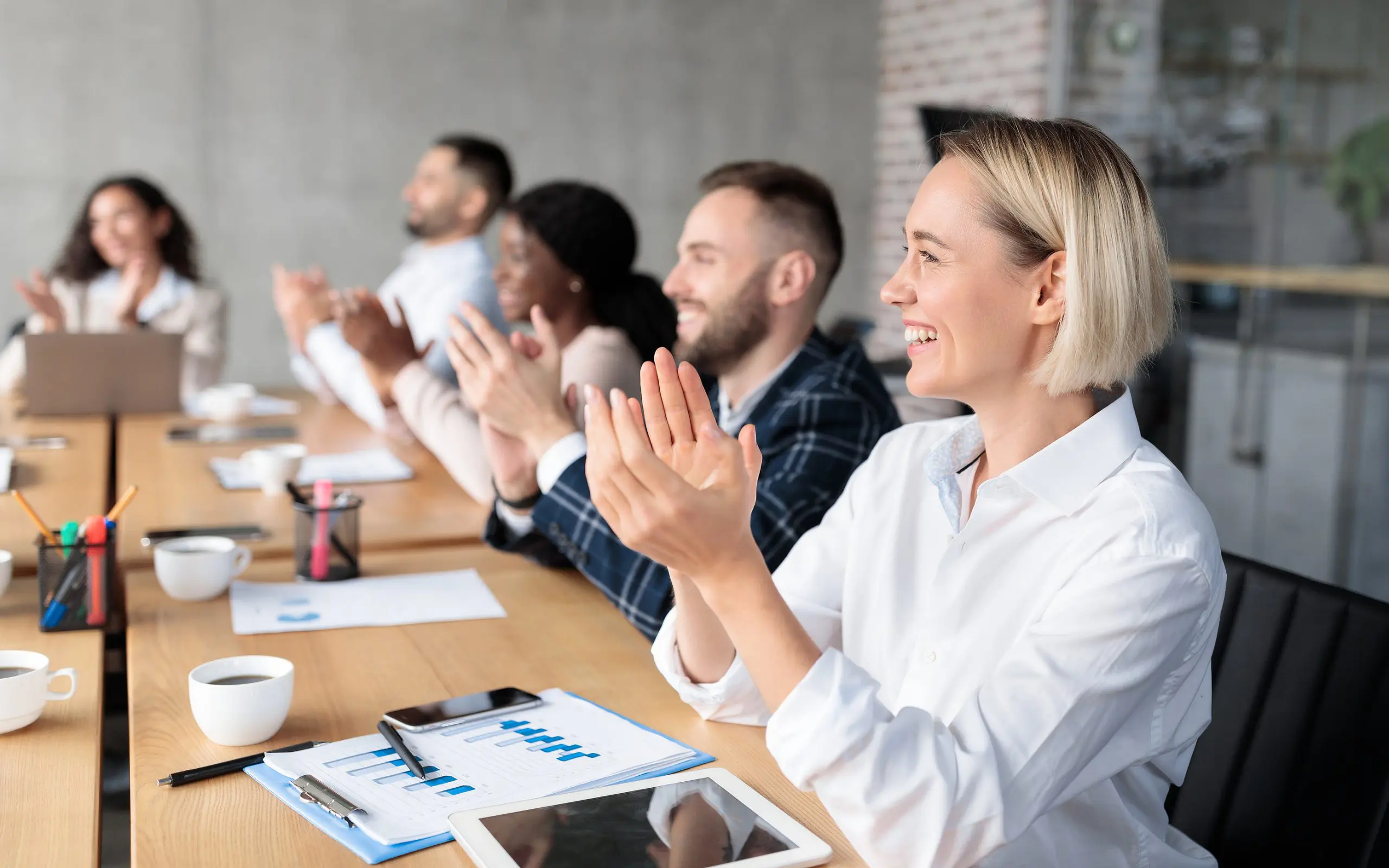 Joyful Coworkers Applauding Celebrating Business Success Sitting