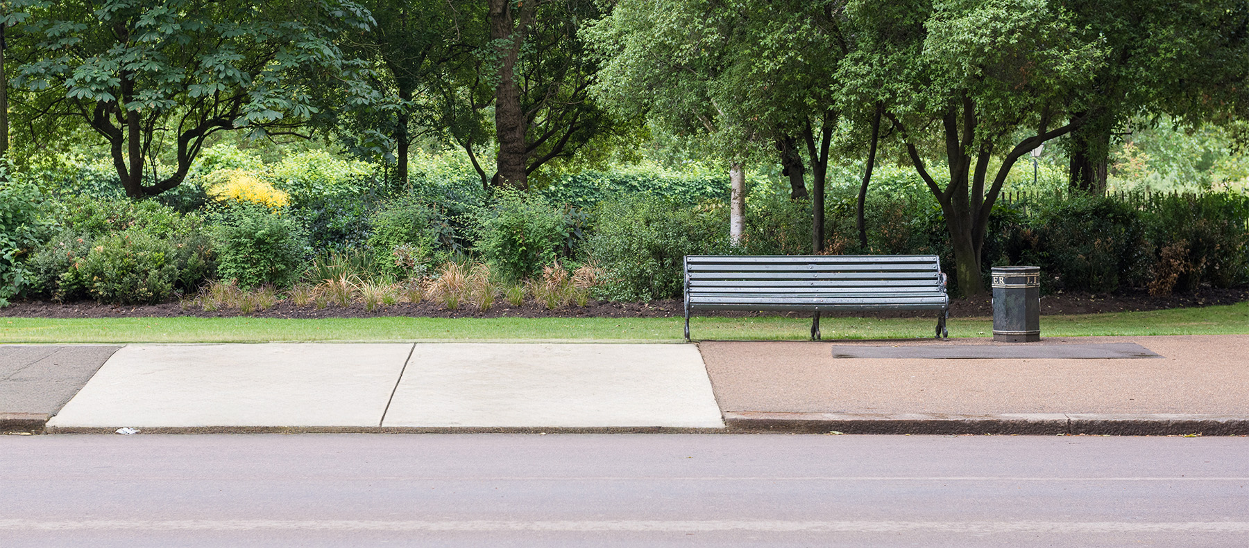 Photo of uneven sidewalk where the curb is multiple inches lower into the ground than the neighboring slabs